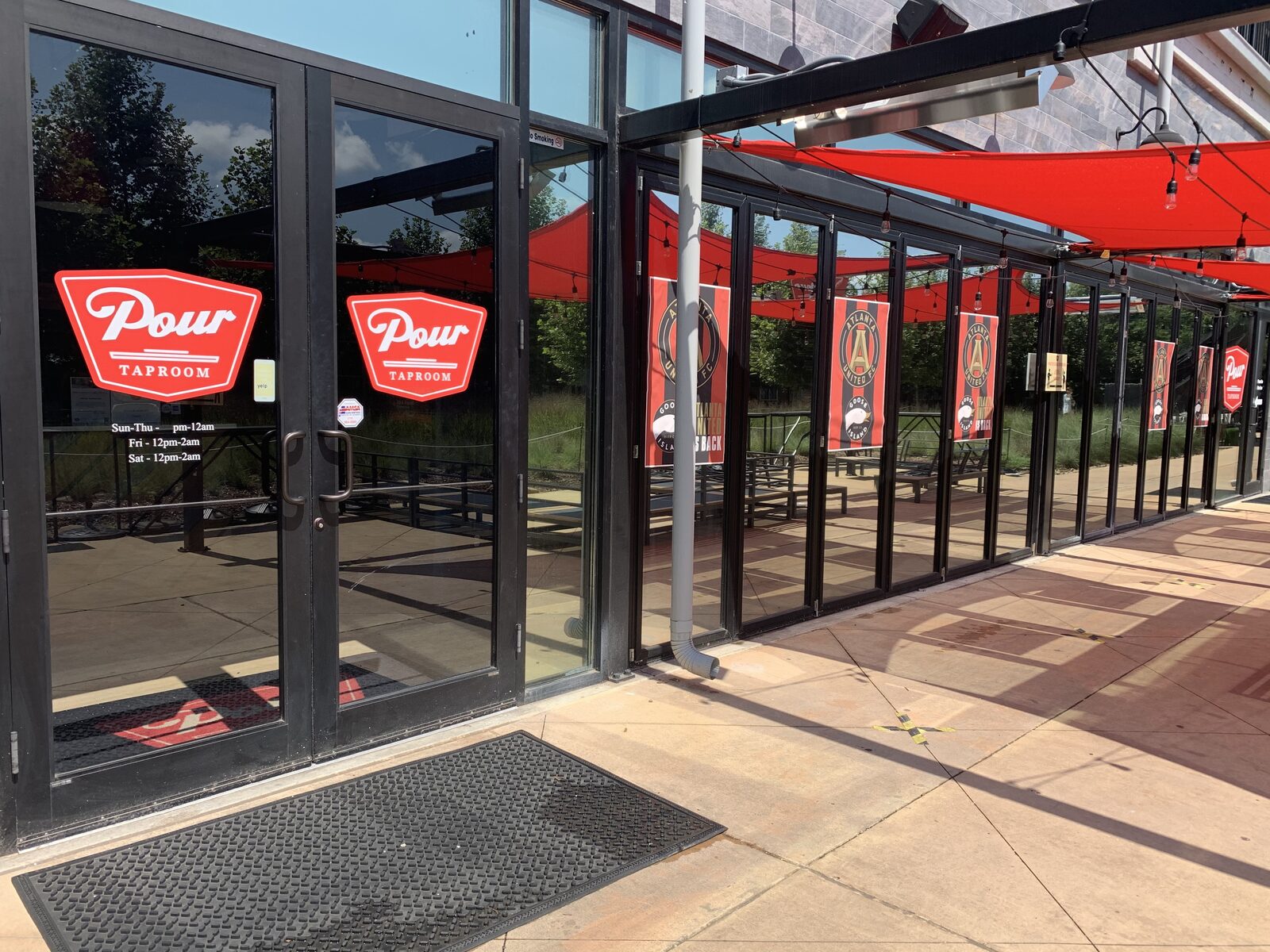 Pour Taproom BeltLine-facing glass frontage with Madico reflective film