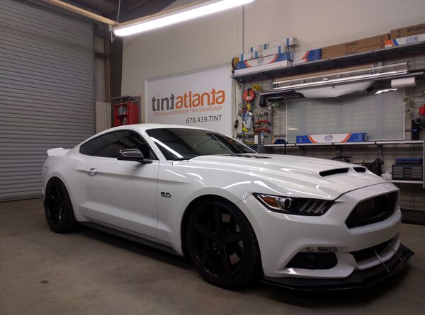 White Ford Mustang GT 5.0 with ceramic window tint installation at Tint Atlanta Woodstock