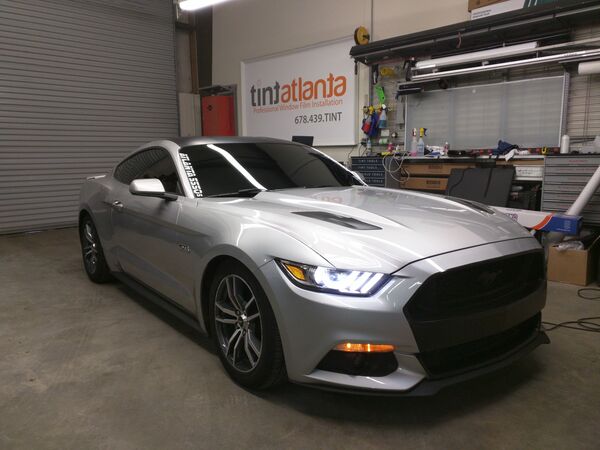 Silver Ford Mustang GT with dark ceramic window tint in Woodstock GA