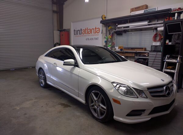 White Mercedes-Benz E-Class Coupe with professional window tinting Atlanta