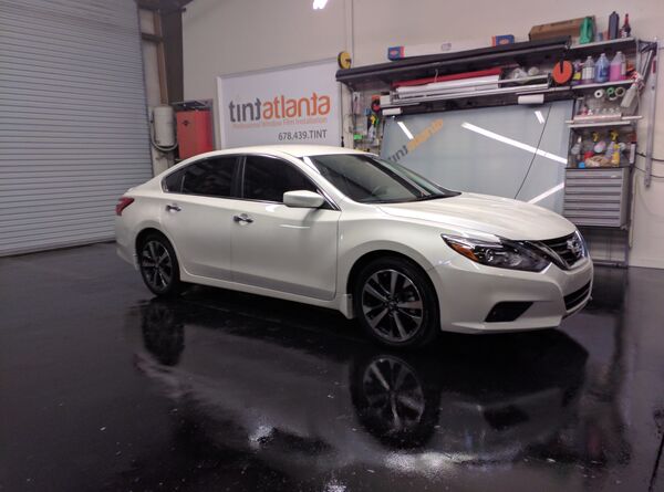 White Nissan Altima sedan with window tint installation Tint Atlanta
